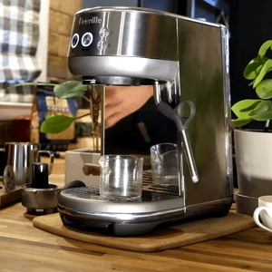 Breville Bambino Plus compact ThermoJet espresso machine with automatic milk frothing.