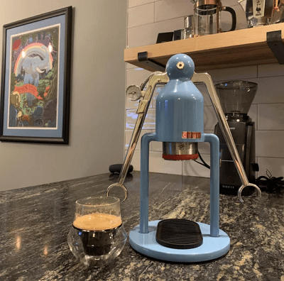 Cafelat Robot Barista manual lever with gauge and portafilter on a counter.