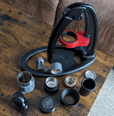 Flair Classic manual espresso maker with brew head and tamper on a counter.