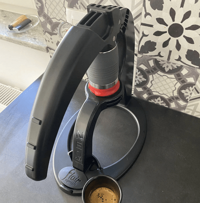 Flair NEO Flex manual espresso maker assembled with Flow-Control portafilter on a counter.