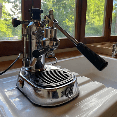 La Pavoni Europiccola manual lever espresso machine on a counter.