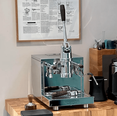 Londinium R24 spring-lever espresso machine with tall lever and polished body.