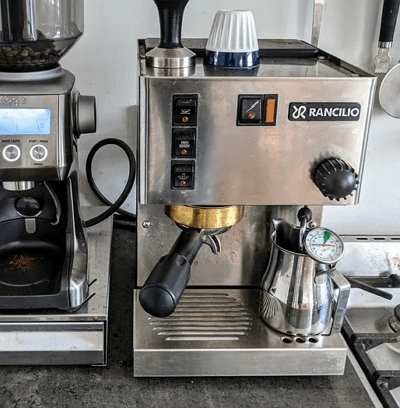 Rancilio Silvia compact stainless steel single-boiler espresso machine on a kitchen counter.