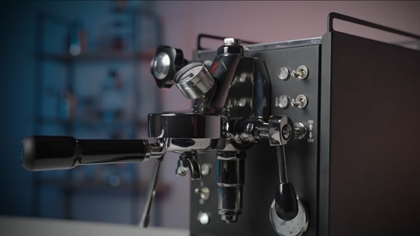 Angled view of the Mini Cellini showing the E61 group, lever, and steam wand.