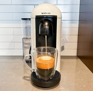 Nespresso Vertuo Plus with motorized head and rotating water tank.
